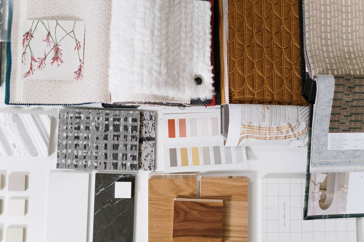 Fabric, leather and colour swatches laid out for a design selection